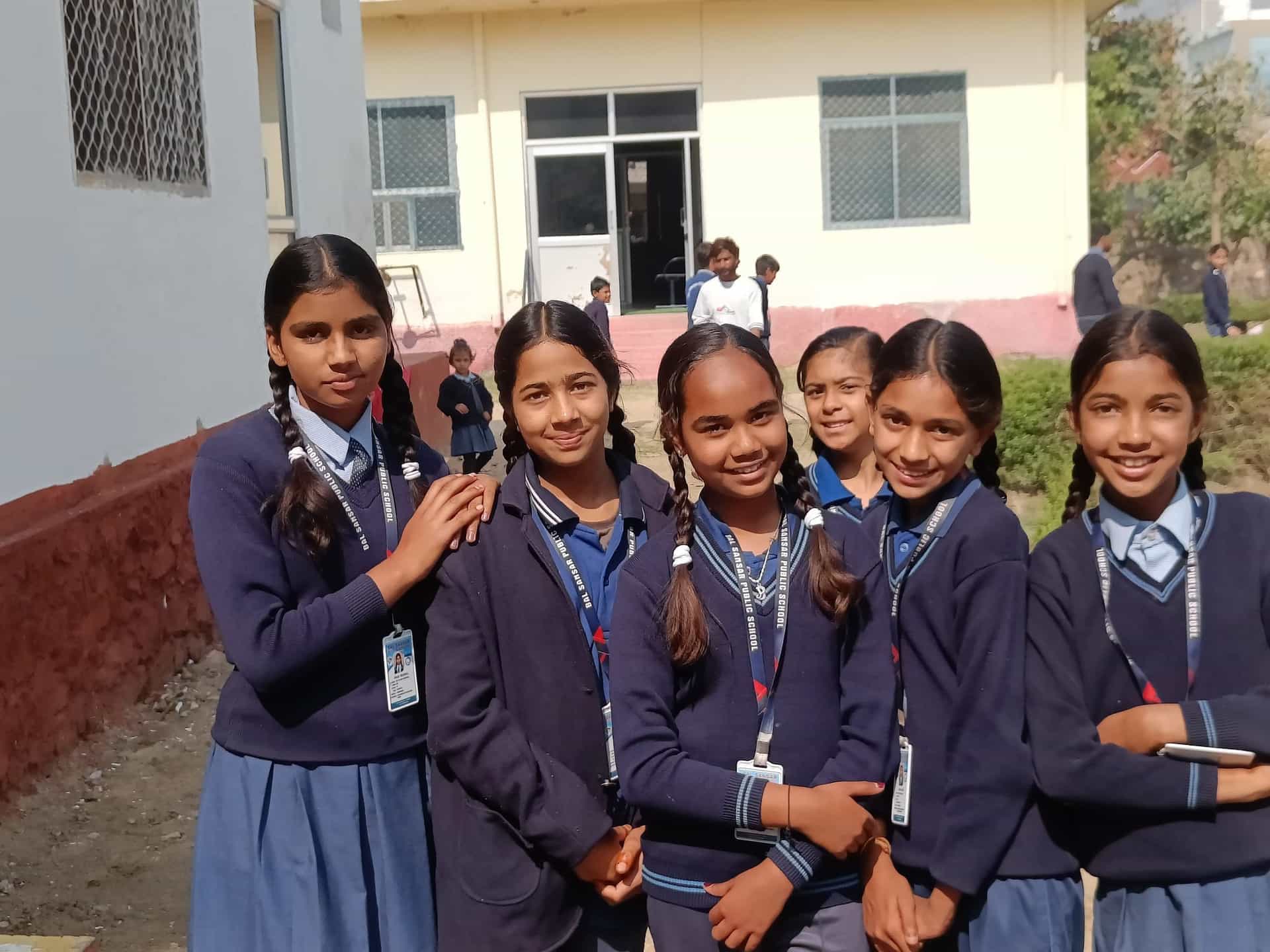 BSPS girls in winter uniform outside the school building