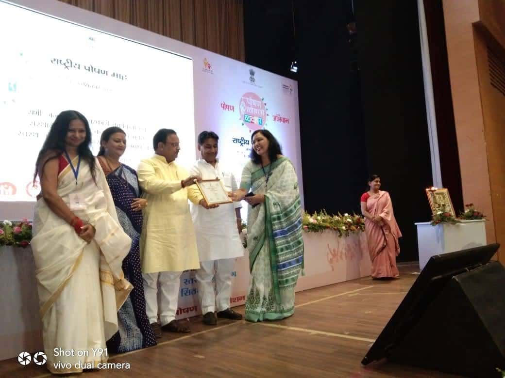 Dr. Priyamvada Singh receiving award at National Nutrition Month ceremony