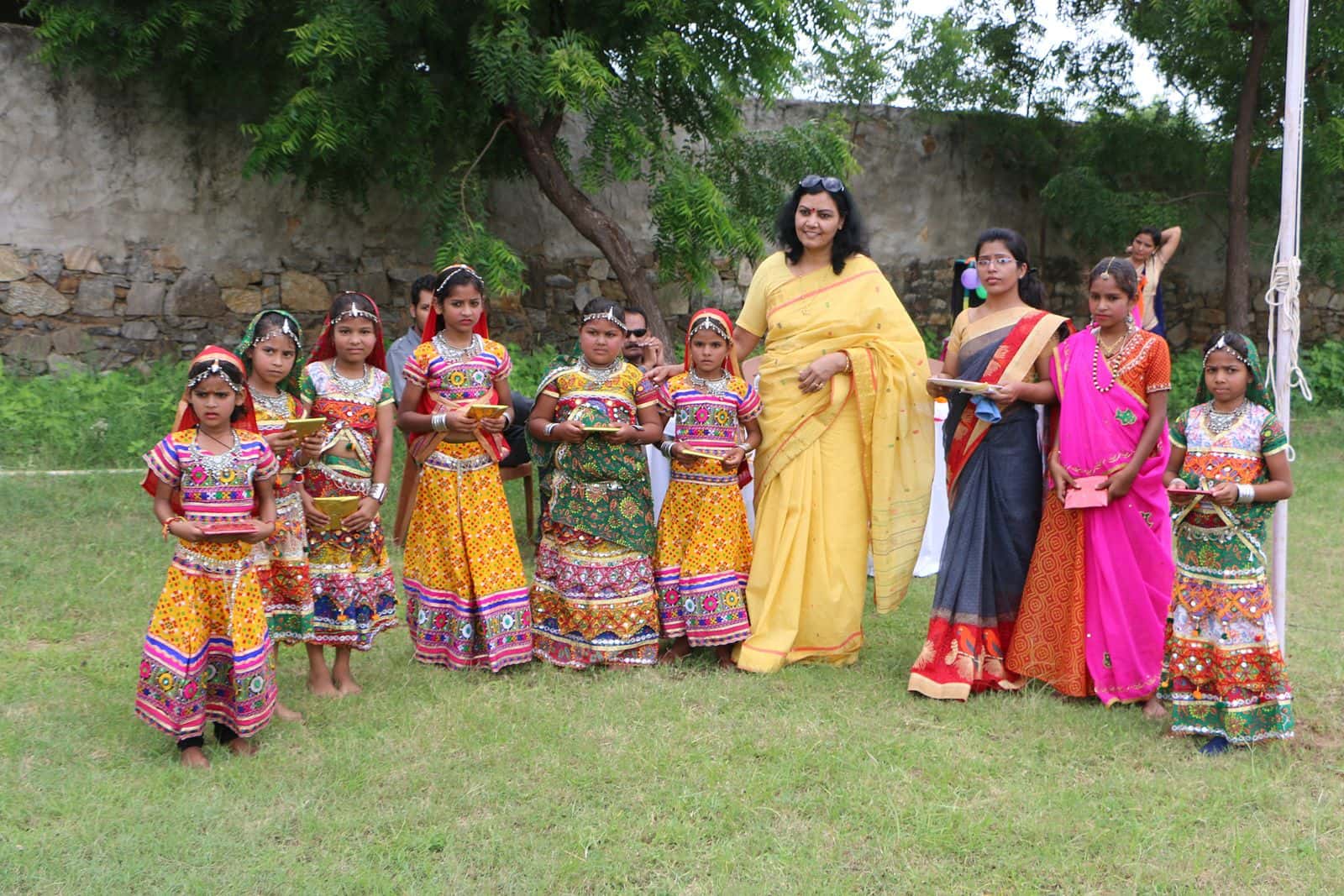Students performing Rajasthani folk dance in traditional costumes