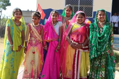 Girl students in traditional dress at a cultural event