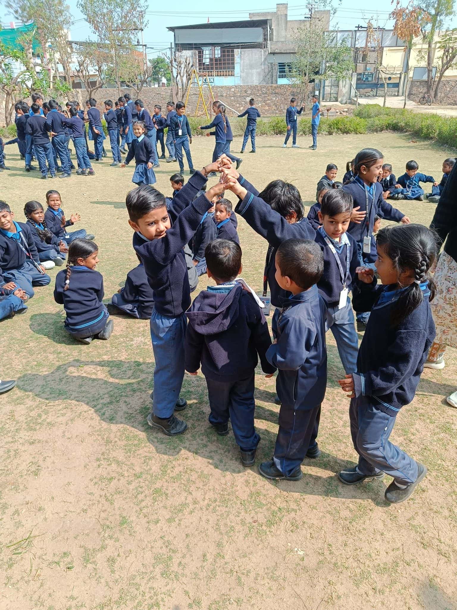 Children playing circle games during recess