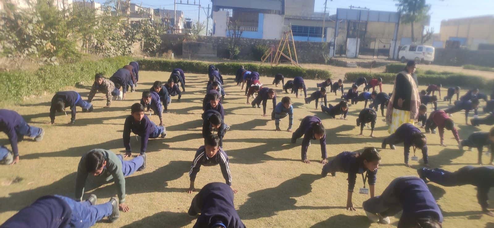 Students doing physical exercise on the school field