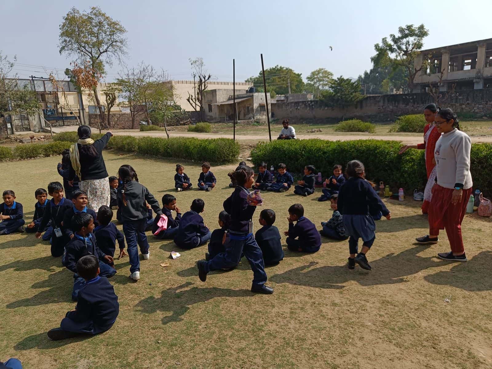 Primary-school children playing on the lawn at the Bal Sansar Sanstha campus in Ajmer