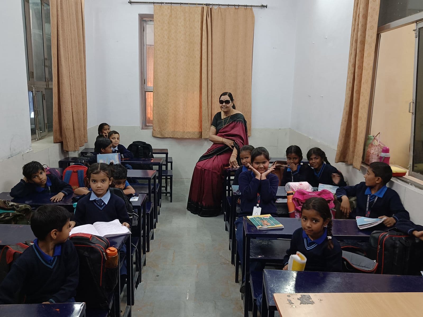 Teacher and students sharing a warm moment in the classroom