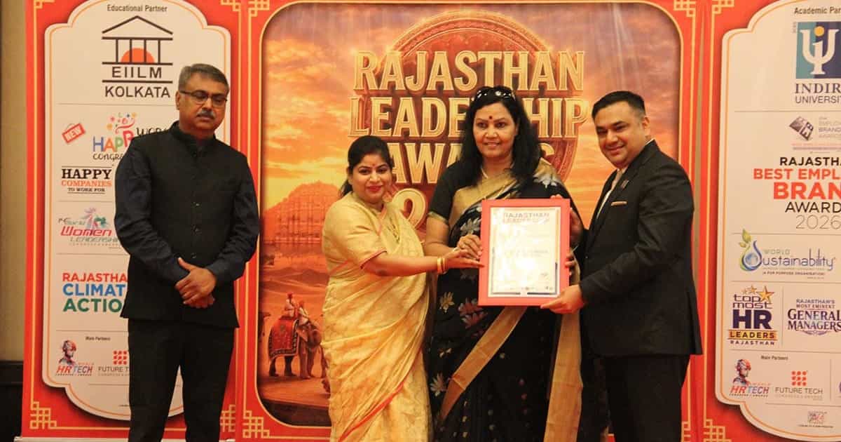 Dr. Priyamvada Singh receiving the framed Rajasthan Leadership Award 2026 on stage