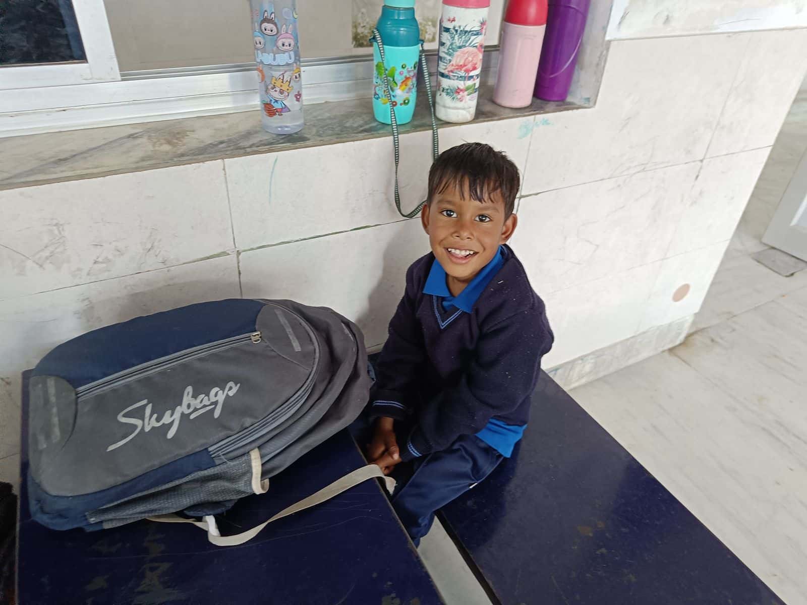 BSPS student smiling with his school backpack